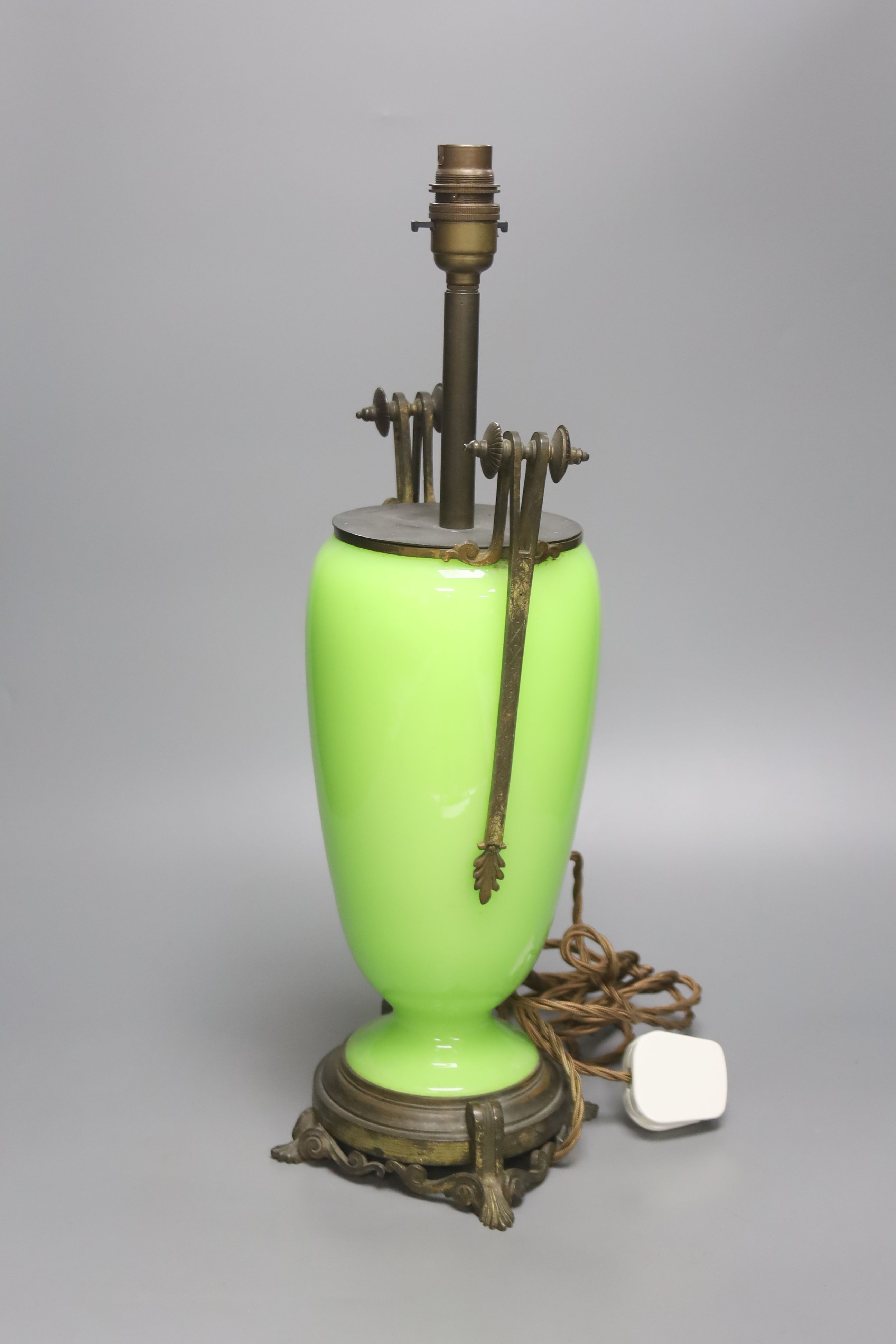 A uranium yellow glass vase desk lamp with applied cast metal mounts, 49cm high